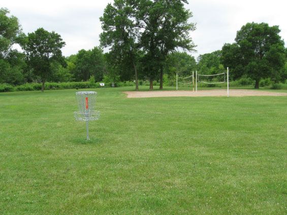 isc golf stand with volleyball court in background